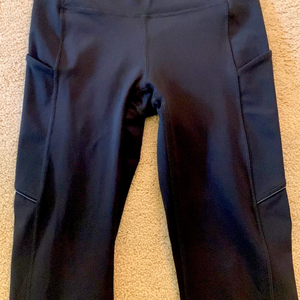 Brand new and never worn black Lululemon leggings. Side pockets, size 4